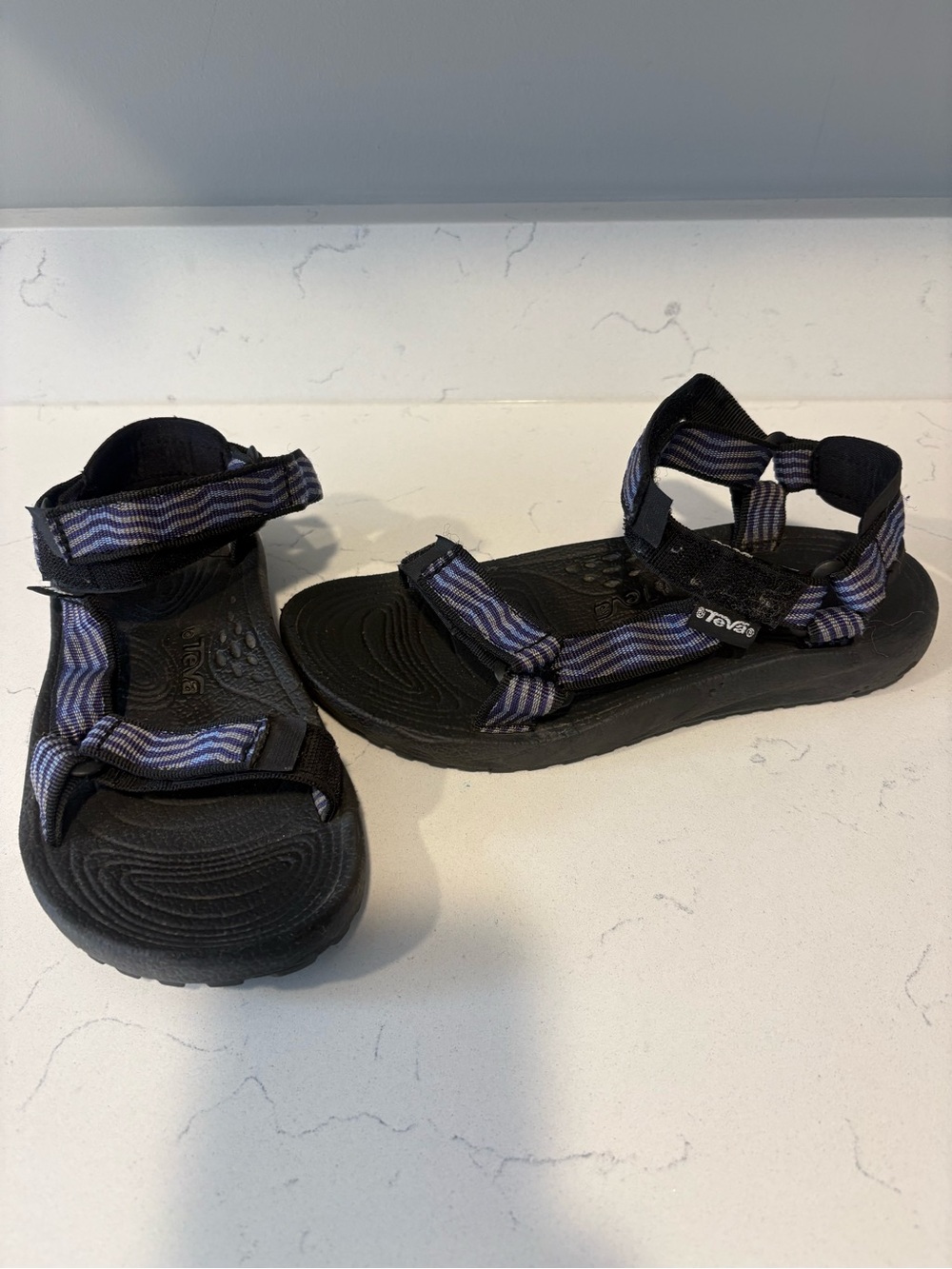 Teva woman’s purple and grey striped Sandals